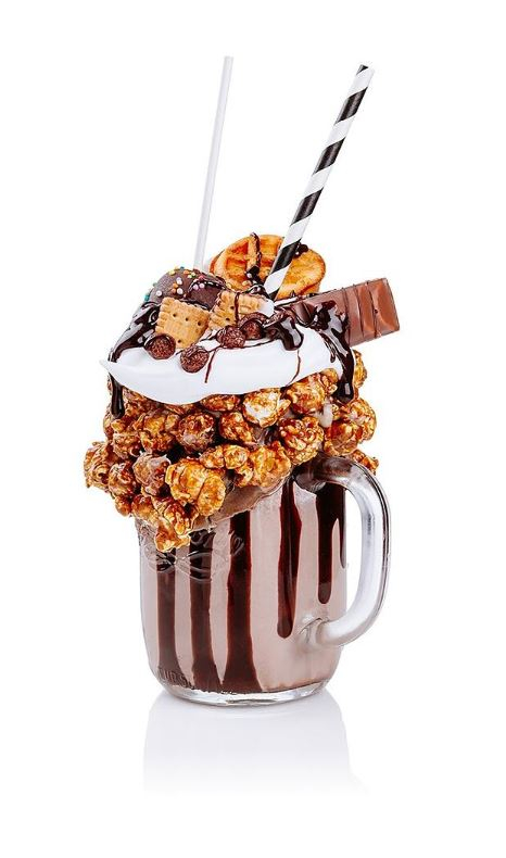 Crazy chocolate milkshake with popcorn, chocolate and waffle toppings